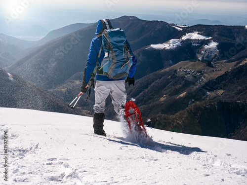 Close-up of snowshoeing activity in the italian alps photo