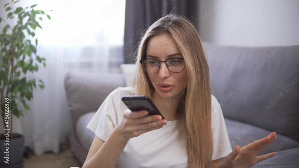 Woman using virtual assistant on mobile phone, recording answering by audio message Woman using virtual assistant on mobile phone, recording answering by audio message