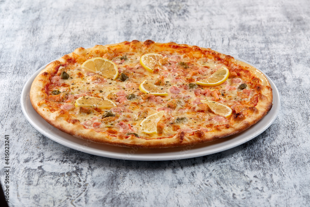 fresh pizza on the white plate fresh pizza on the white plate