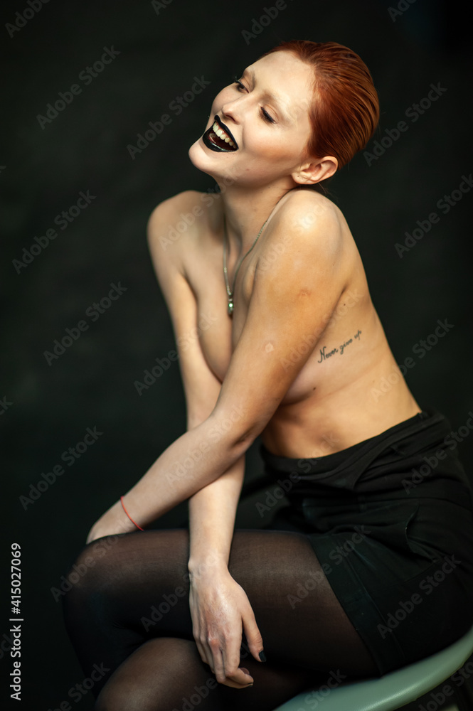 Beautiful fashion woman. Close emotional portrait of a redhead. Selective focus Beautiful fashion woman. Close emotional portrait of a redhead. Selective focus