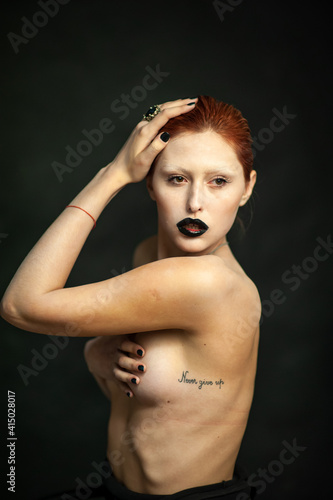 Beautiful fashion woman. Close emotional portrait of a redhead. Selective focus