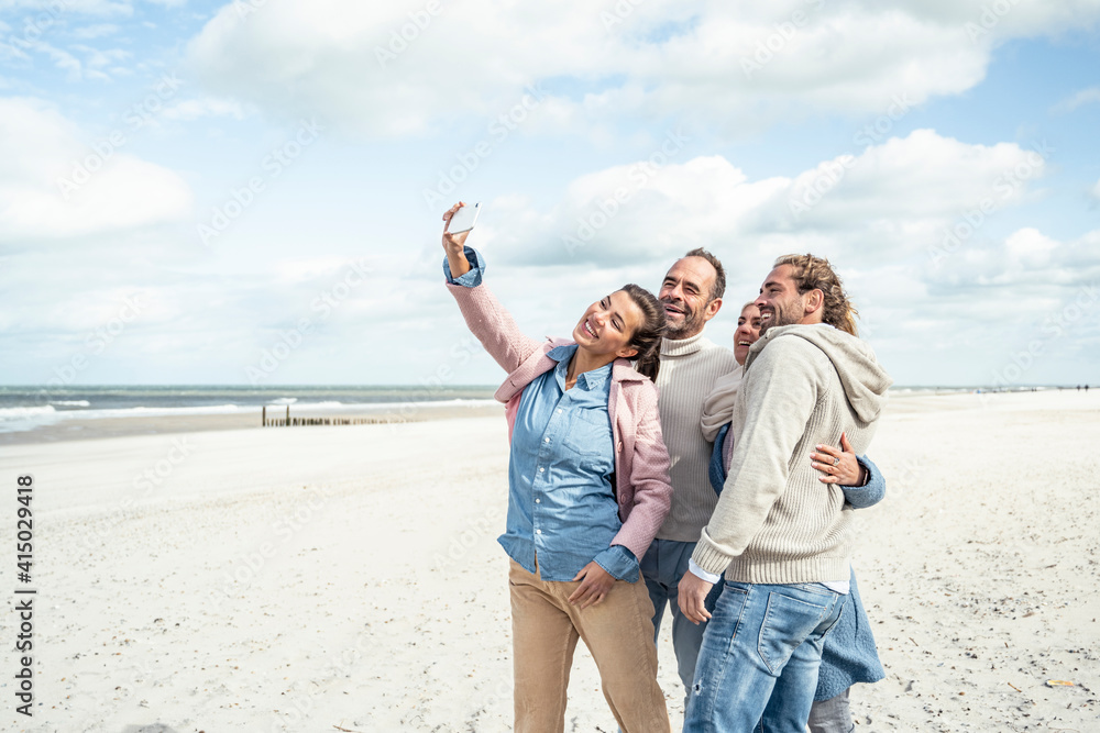 Group of friends taking selfie at beach Group of friends taking selfie at beach