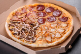 Fresh delicious pizza made in a hearth oven with four types of meat and sausage