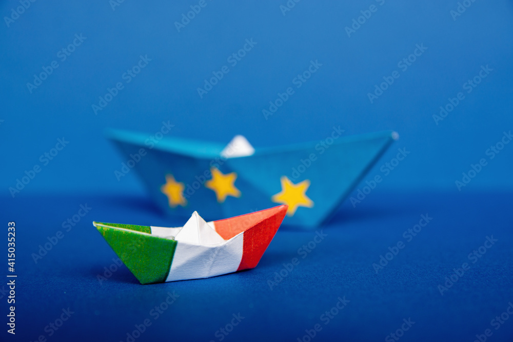 paper ship with Flags of European Union and Italy, the concept of relations between the union and the country, a possible italexit