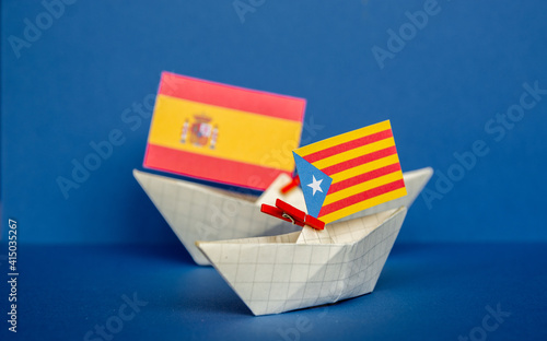 paper ship with national flag of spain, catalonia Catalan,  concept of  conflict between separatism and regional independence 