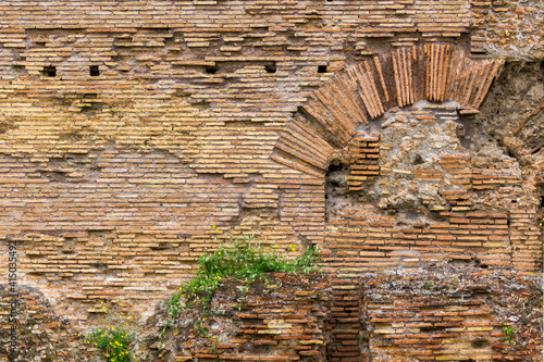 old roman brick wall with arch 