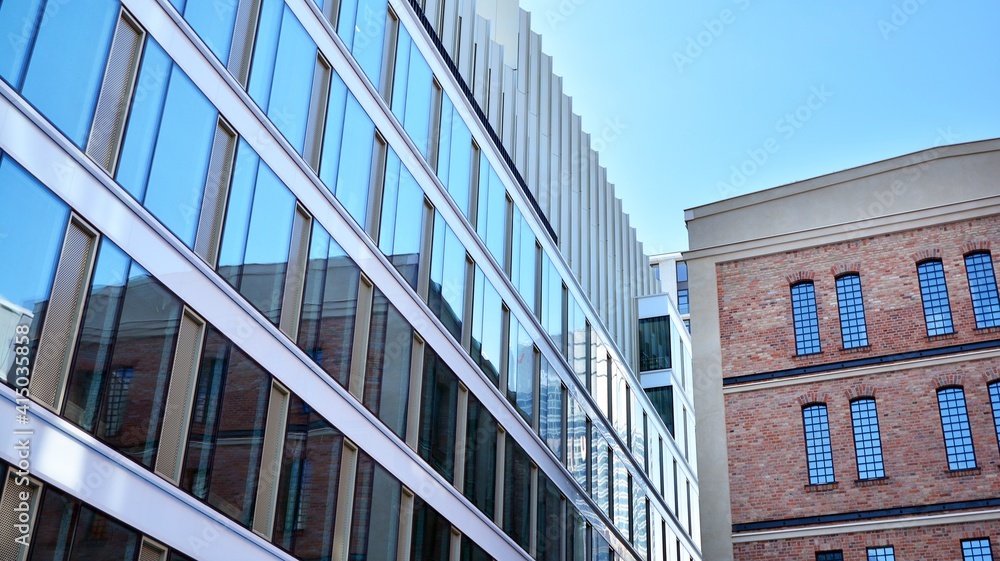Obraz premium Revitalized red brick building and modern office building.
