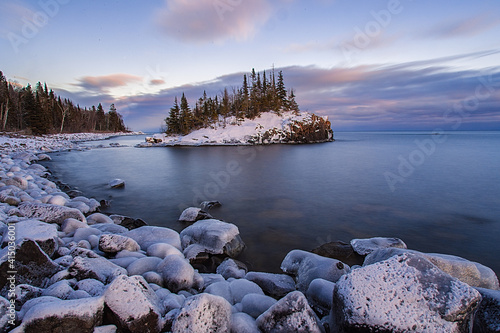 A snow covered island on the Minnesota shoreline on Lake Superior.