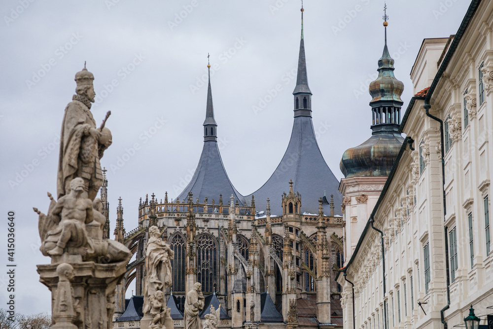Fototapeta premium St. Barbara's Church, Unique gothic Cathedral and Former Jesuit College, gallery with baroque statues at Barborska street in winter, Kutna Hora, Central Bohemia, Czech Republic