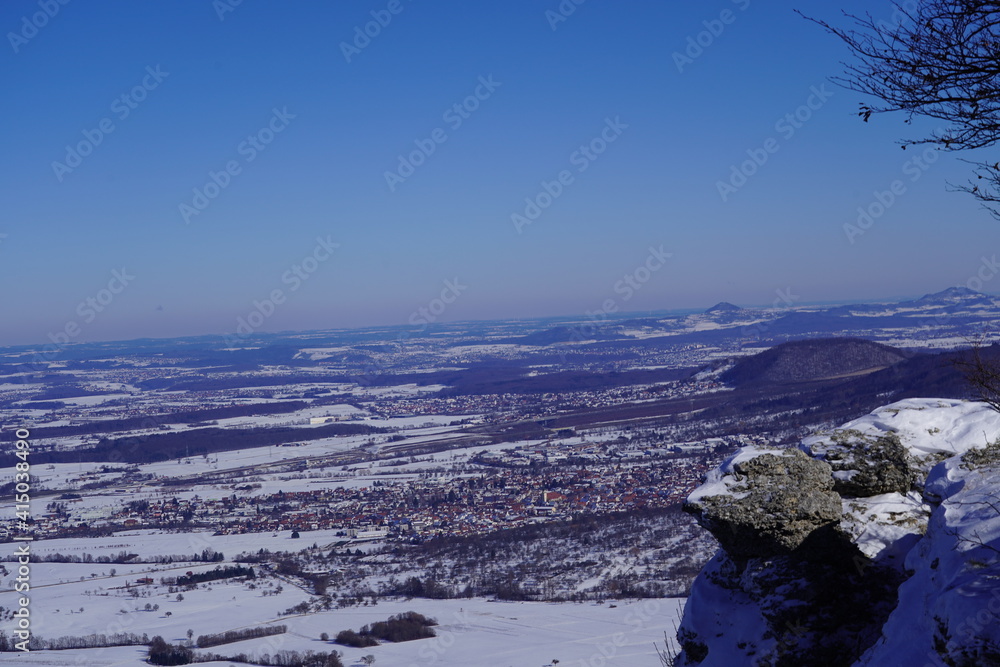 View from the top of Breitenstein on the Swabian Alb, with trees, far view, snow, wintertime, Ochsenwang near castle Teck, Bissingen unter Teck, Germany