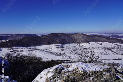 View from the top of Breitenstein on the Swabian Alb, with trees, far view, snow, wintertime, Ochsenwang near castle Teck, Bissingen unter Teck, Germany