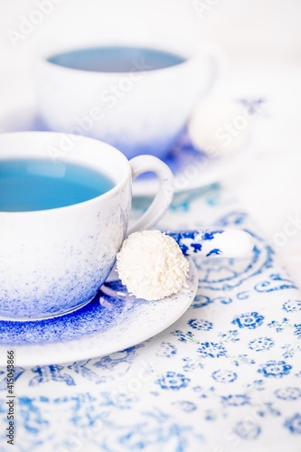 Bllue tea or clitoria flowers drink and coconut candy