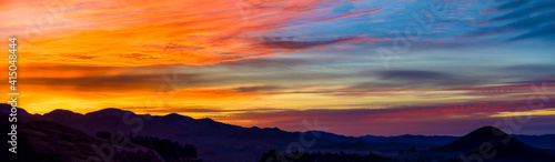 Panorama at sunset, silhouetted horizon © Mark