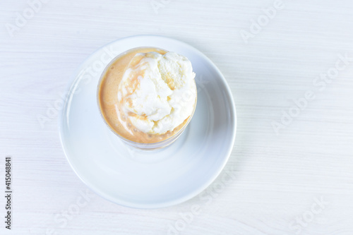  Coffee and chocolate milkshakes  with chantilly cream on white wooden background