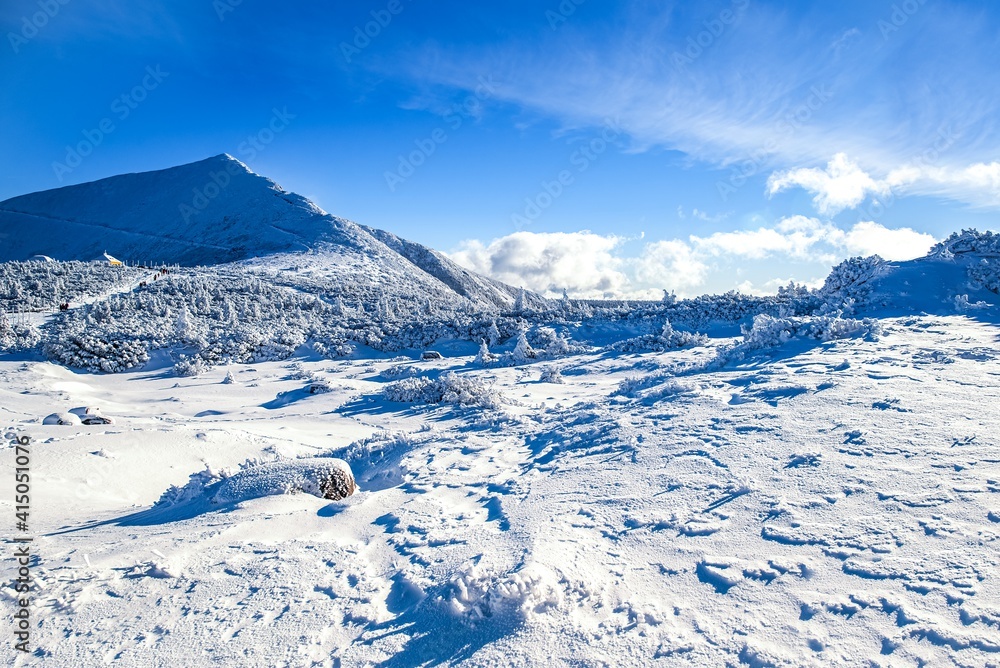 snow at the foot of the mountain, a sunny frosty day snow at the foot of the mountain, a sunny frosty day