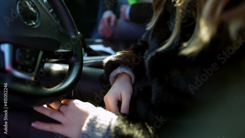 Unrecognizable young woman hitting hand of cocky man making a pass. Male passenger flirting with angry female driver in car. Relationship concept.