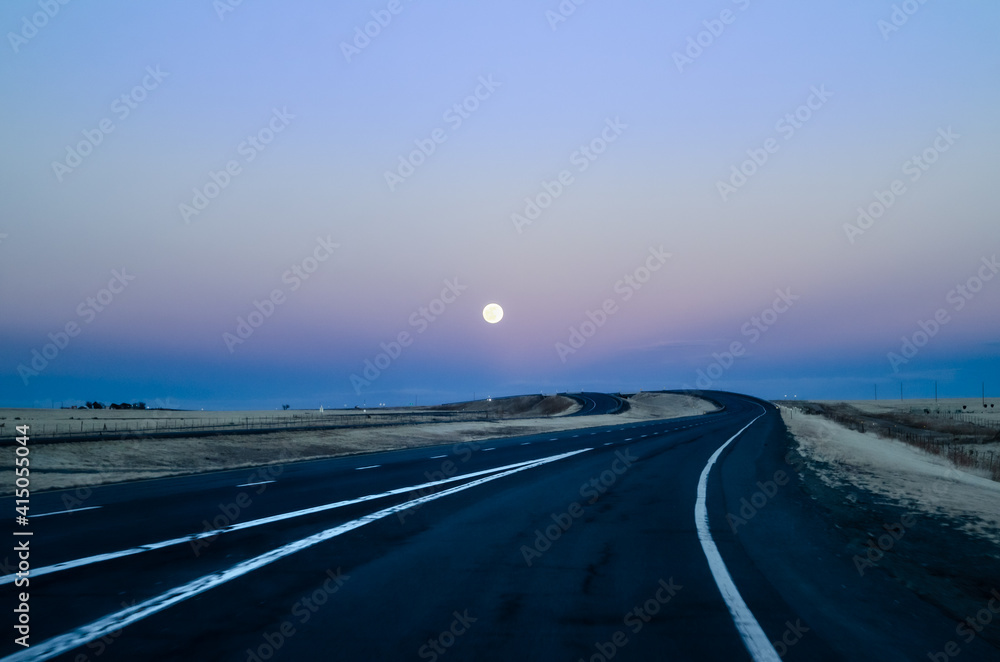 Moon rise on the highway