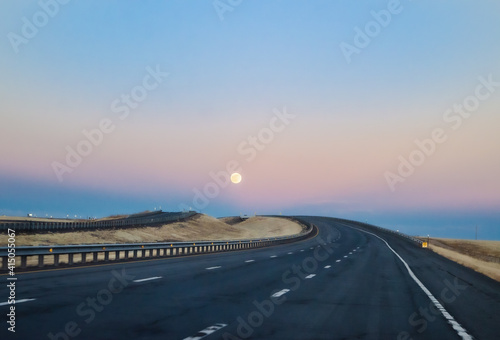 Moon rise driving on the highway