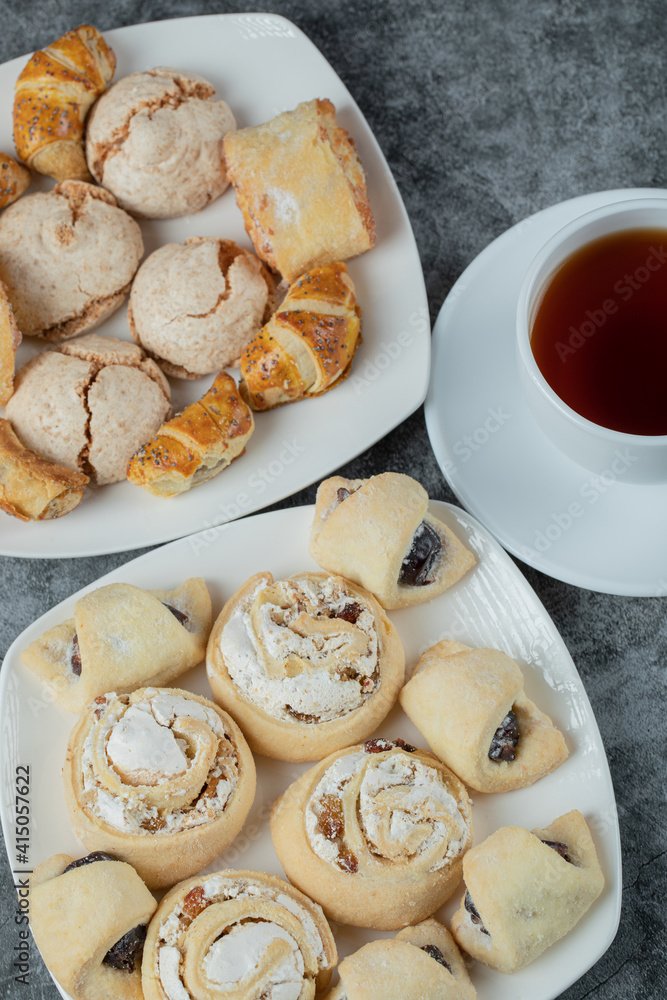 Butter cookies served with a cup of tea Butter cookies served with a cup of tea