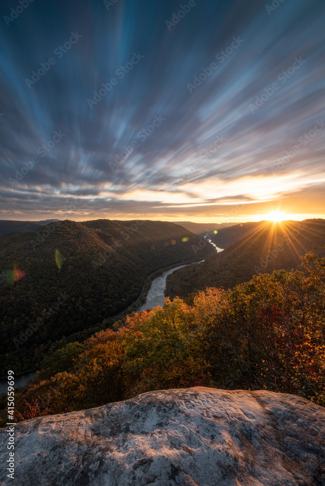 A long exposure view of the New River Gorge National Park at sunrise during October.
