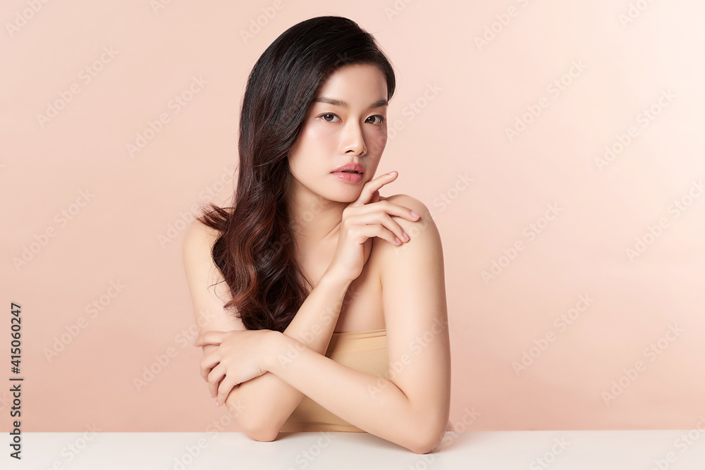 Beautiful young asian woman with clean fresh skin on beige background, Face care, Facial treatment, Cosmetology, beauty and spa, Asian women portrait Beautiful young asian woman with clean fresh skin on beige background, Face care, Facial treatment, Cosmetology, beauty and spa, Asian women portrait