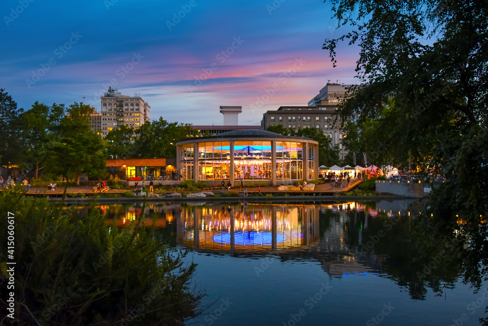 Evening sunset along the Spokane River in Riverfront Park, a public urban park with carousel and events in the city of Spokane, Washington, USA