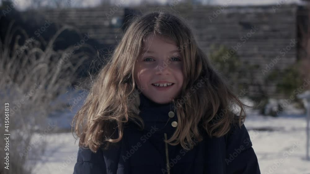 Beautiful Young Child Smiling With Snowball Thrown in Her Face in Slow Motion Beautiful Young Child Smiling With Snowball Thrown in Her Face in Slow Motion