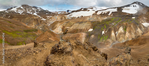 Hikers in the geothermal area of Hveradalir in the mountains of Kerlingarfjoll in the highlands of Iceland. photo