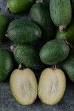 Green and half feijoas in the stock