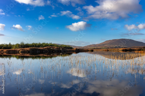 Small lake reflecting clouds near Clifden  Ireland