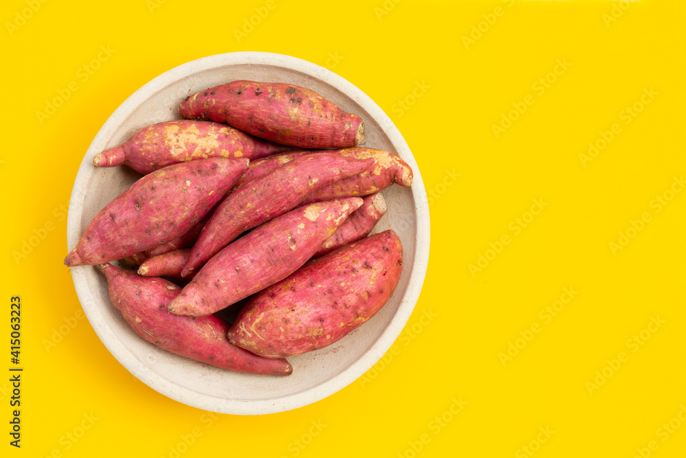Sweet potato on yellow background. Sweet potato on yellow background.