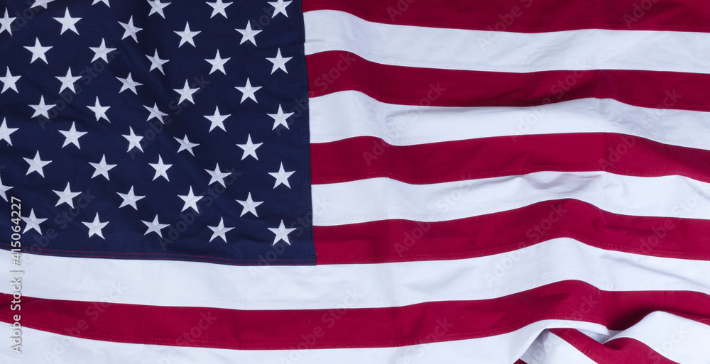 Obraz premium Waving USA flag for the holidays of Memorial, 4th of July and Veterans Day