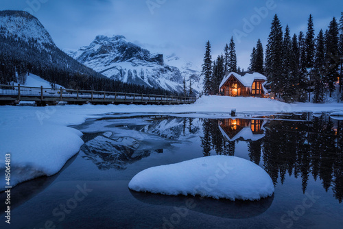 Evening blue hour reflections of the Cilantro Cafe of the Emerald Lake Lodge in Yoho National Park during the Winter.