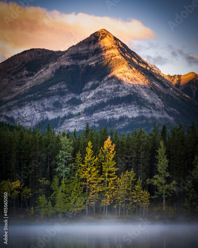 Alpine glow warming the peak of this mountain at Wedge Pond at sunrise during a late September morning.