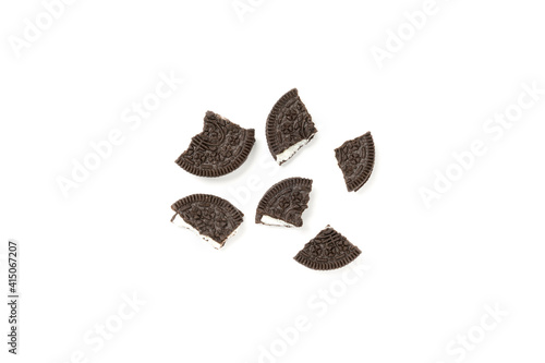 Biscuits chocolate  with crumbs on white background. It is a chocolate cookies with a sweet cream.