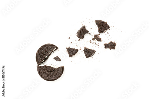 Biscuits chocolate  with crumbs on white background. It is a chocolate cookies with a sweet cream.