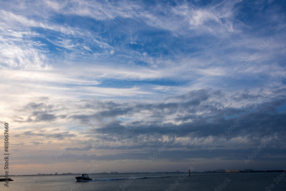 Boat in the ocean on the summer day blue skies Boat in the ocean on the summer day blue skies
