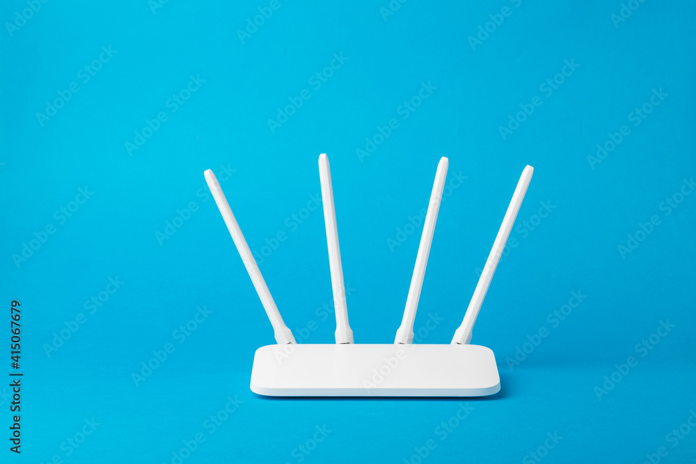 Wi-Fi router with four white antennas on a blue background. - obrazy, fototapety, plakaty 