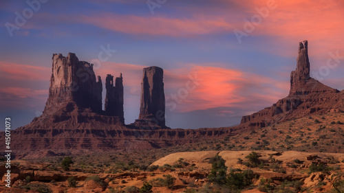 Rock formations at monument valley under evening sky