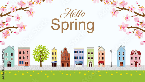Old style town in Springtime with two branches of cherry blossom - Included words "Hello Spring" © sayuri_k