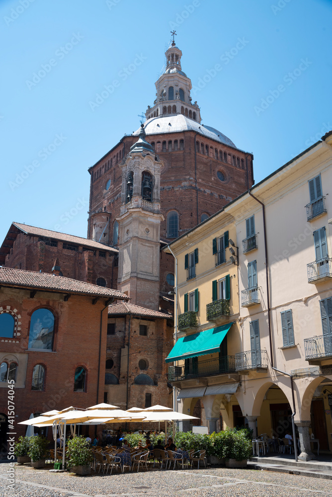 Italy, Lombardy, Pavia. Cathedral and outdoor cafe