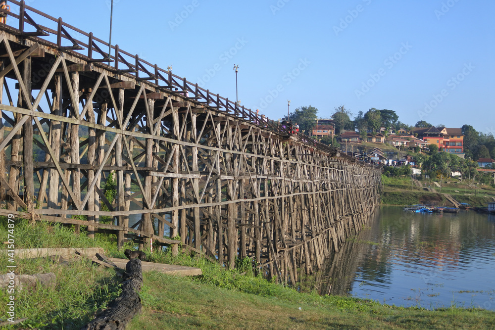 View of Mon Bridge crossing Songkalia River, Thailand's longest wooden bridge. View of Mon Bridge crossing Songkalia River, Thailand's longest wooden bridge.