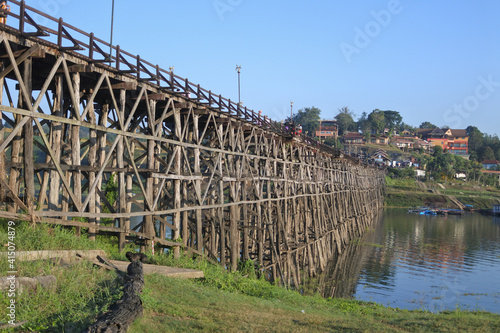 View of Mon Bridge  crossing Songkalia River, Thailand's longest wooden bridge.