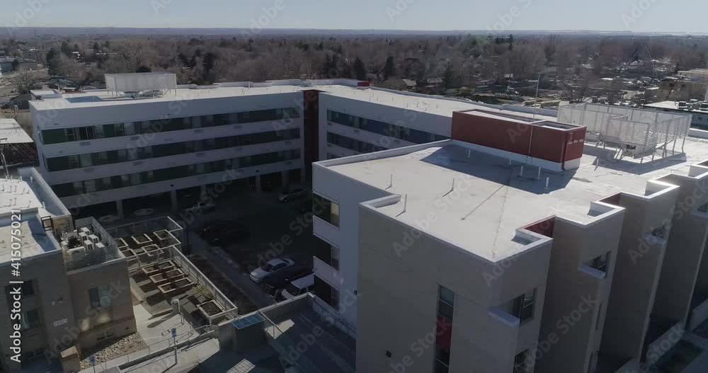 West Denver urban development apartments showing raised community garden. 4k drone high bit rate 2021. West Denver urban development apartments showing raised community garden. 4k drone high bit rate 2021.