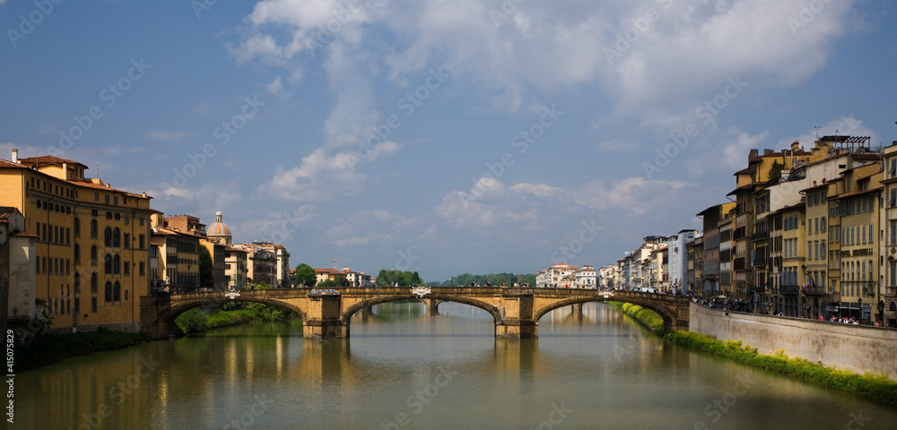 Italy, Florence. Ponte Vecchio bridge crosses River Arno.