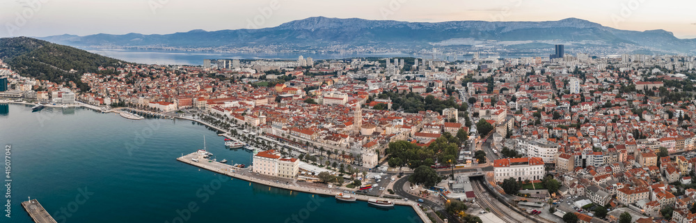 Panoramic aerial view of Diocletian Palace in empty Split old town by riva before sunrise in croatia summer
