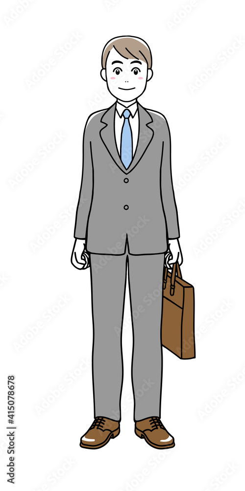A man in suit standing with a business bag in his hand