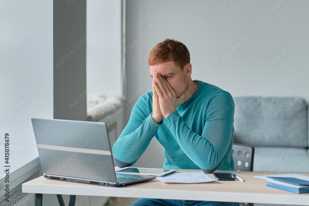 Tired exhauste sitting at work desk. office man stressed at work. sad guy working tired. Tired exhauste sitting at work desk. office man stressed at work. sad guy working tired.