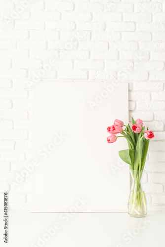 Fototapeta Naklejka Na Ścianę i Meble -  Mock up with Frame and pink Tulips on white brick wall background