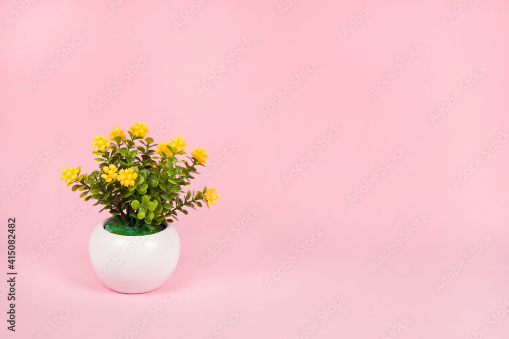 Spring banner with toy potted flowers on pink background, copy space for design. Flower minimal concept. Hello, spring.